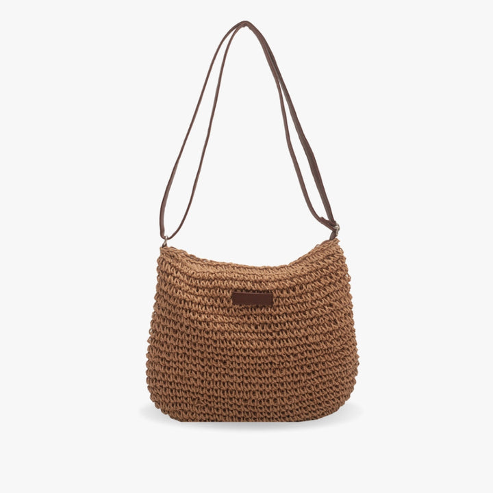Trendy women's shoulder bag, woven design for a relaxed summer vibe. Perfect casual accessory.