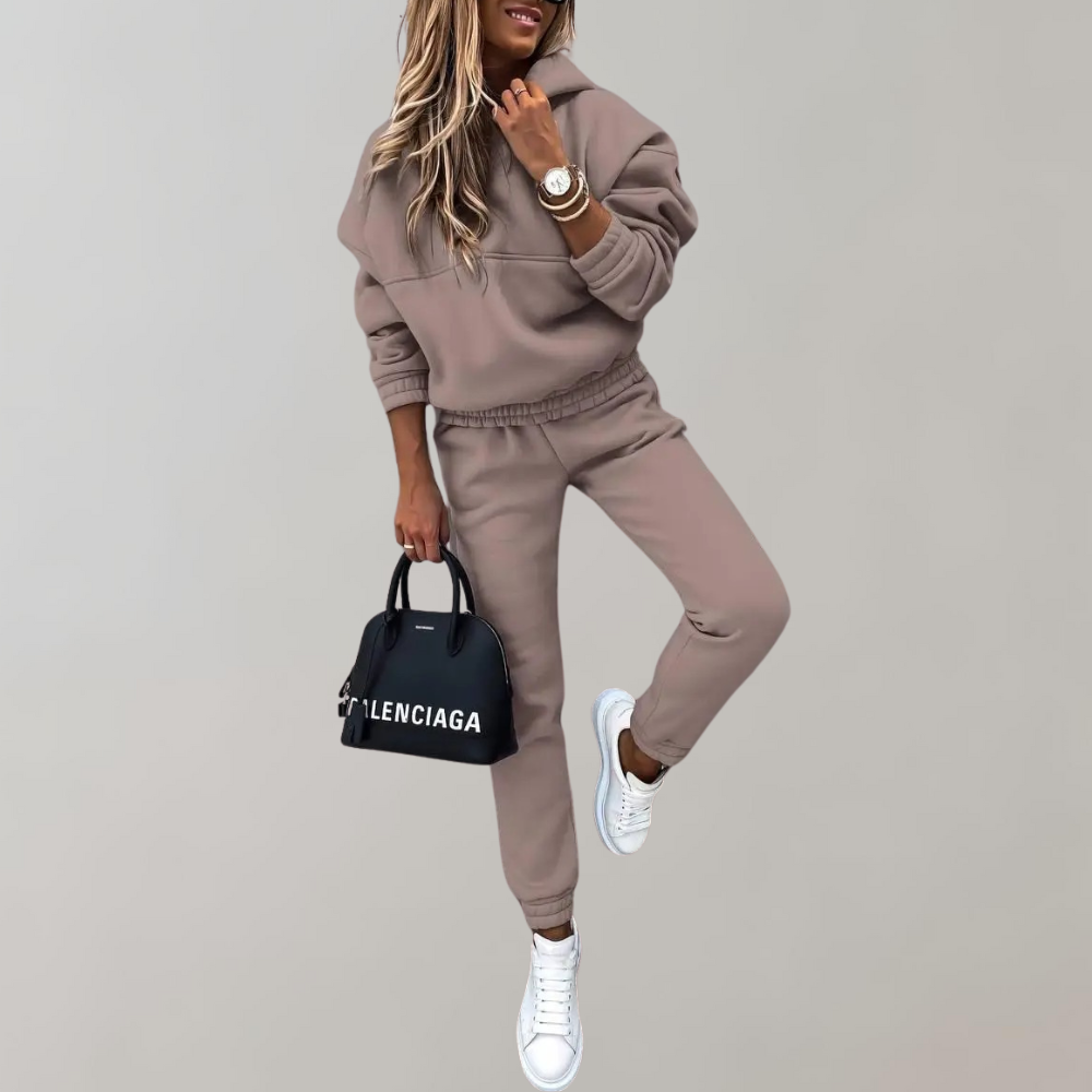 Retro style women's tracksuit with hood, ideal for athletic wear, casual outings, or comfy loungewear. Solid.