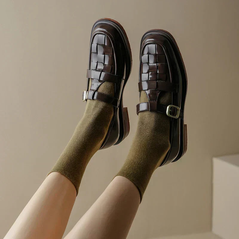 Close-up of vintage style women's flats with intricate woven texture and strap detail