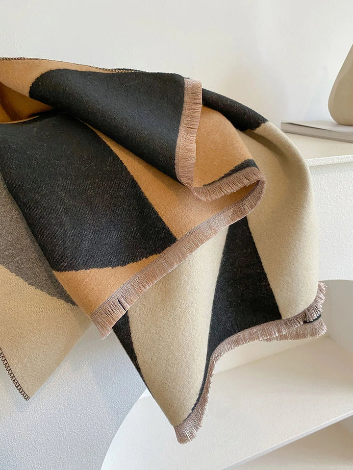 Chic women's reversible cashmere scarf. Provides luxury, softness & warmth for any elegant outfit.