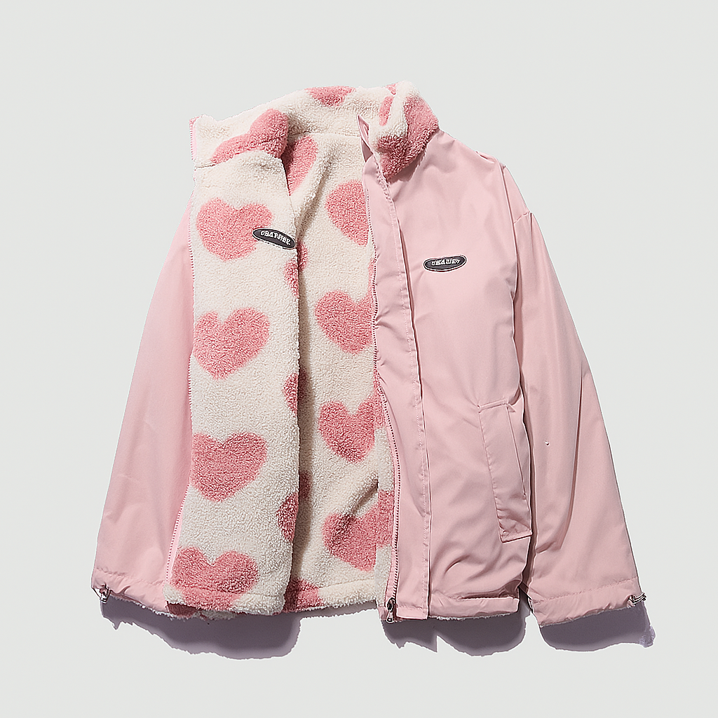 Women's reversible heart motif jacket, black side with white hearts, offering versatile style