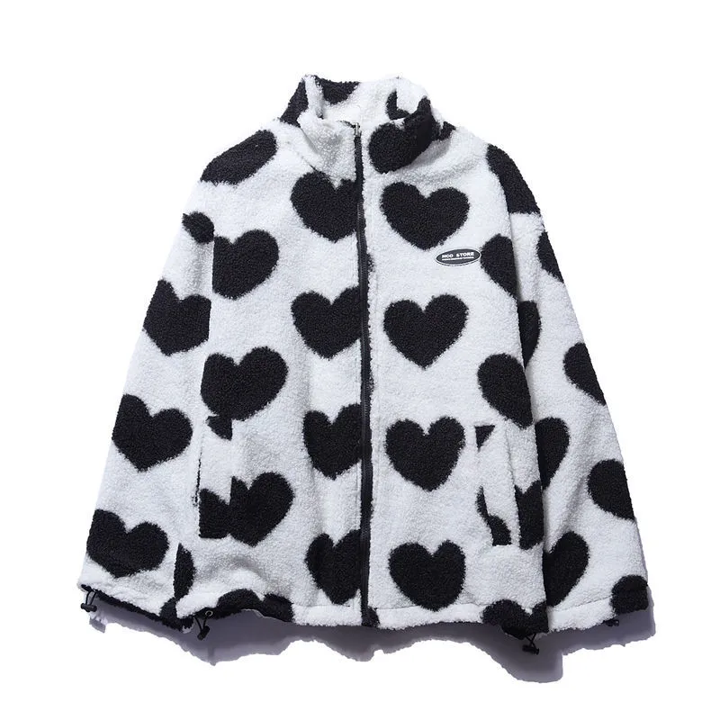 Full shot of a reversible women's jacket with vivid heart patterns, highlighting its unique design and warmth
