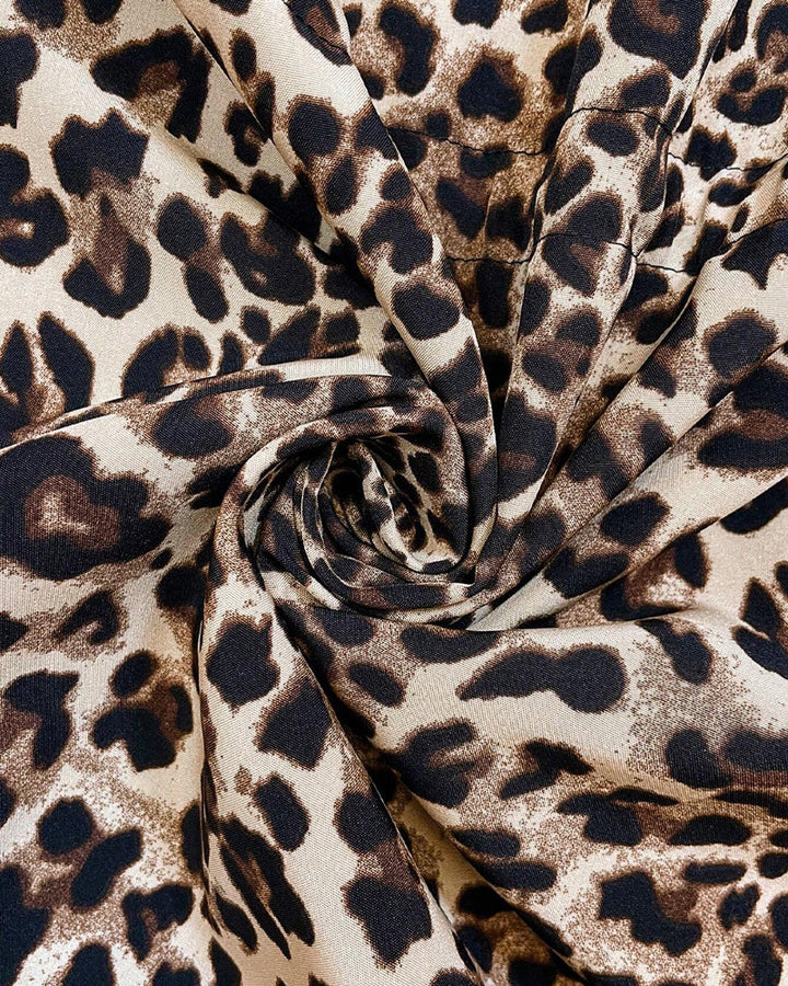 Women's reversible hooded leopard print winter coat styled for a casual autumn outfit