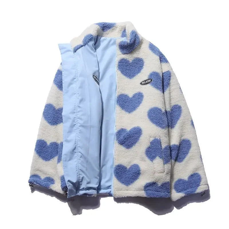Detailed view of reversible zipper on women's heart quilted jacket, high quality outerwear
