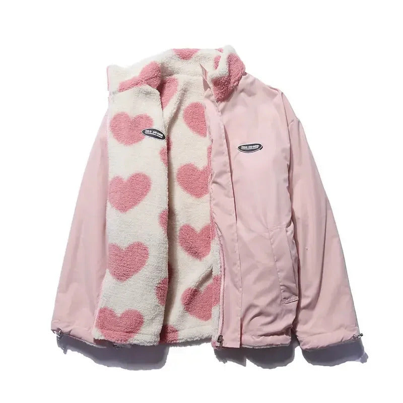 Back view of women's reversible quilted jacket, black, showing full heart pattern coverage