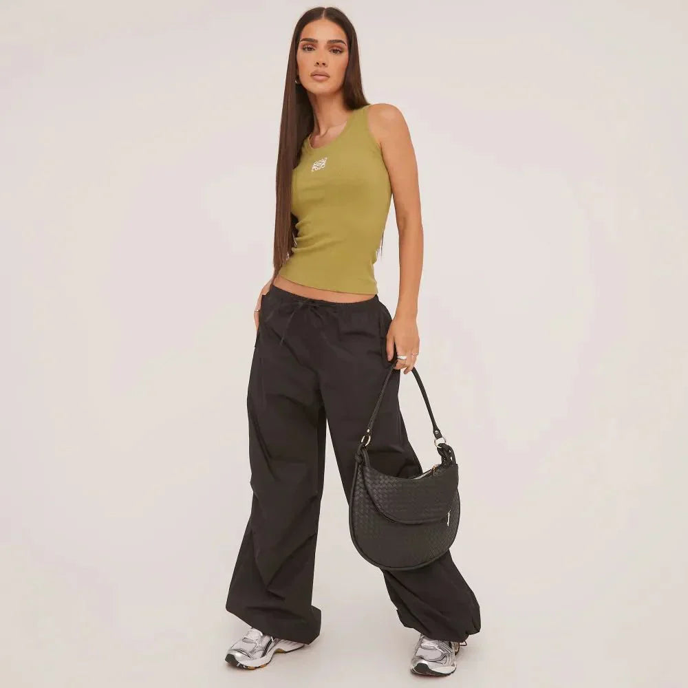 Soft cotton blend women's ripped tank top, intricate embroidery detail. Versatile summer wear.