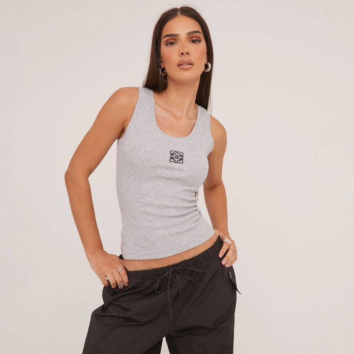 Women's ripped tank top with unique texture & beautiful delicate embroidery. Summer fashion.