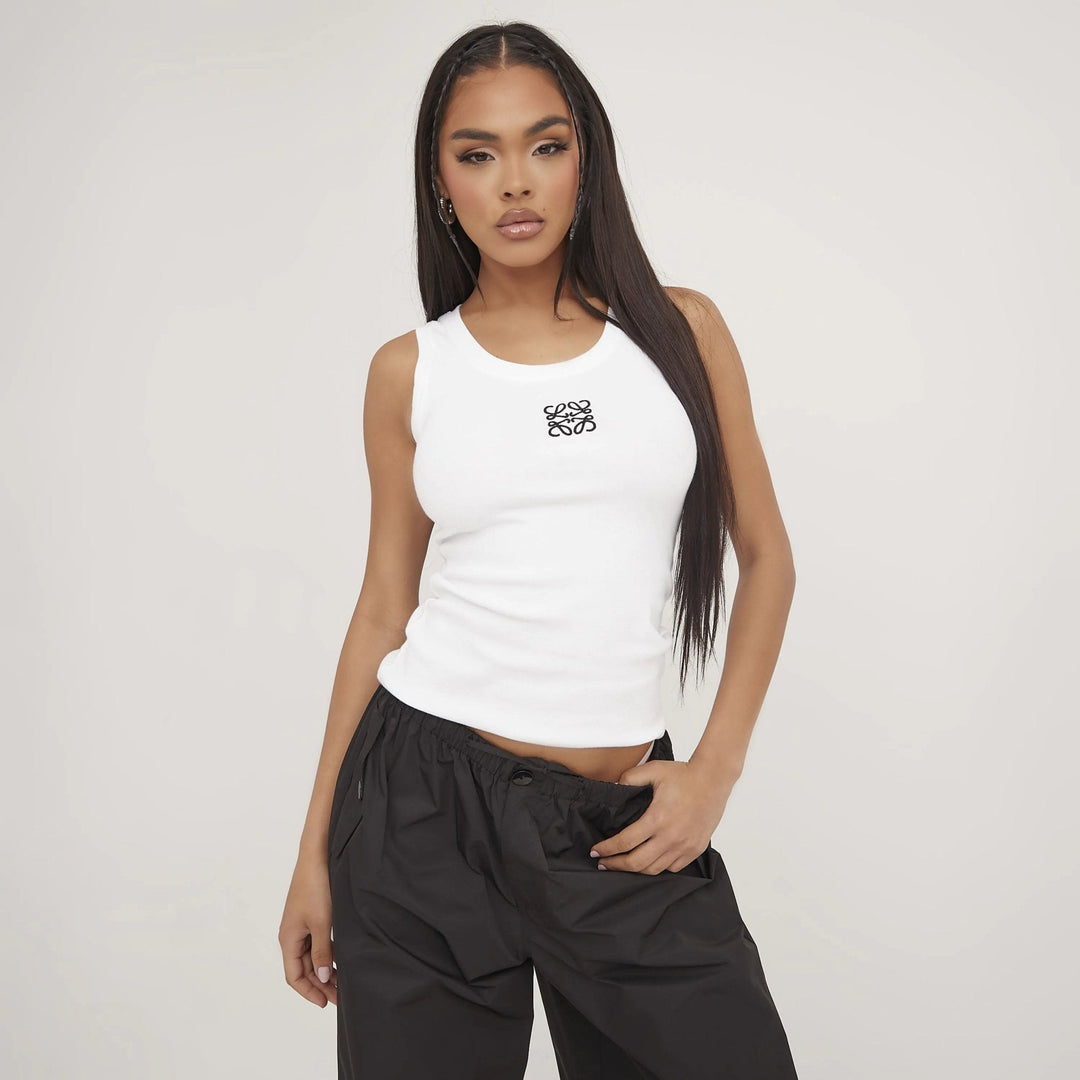 Comfortable women's basic ripped tank top, stylish with delicate embroidery. Daily wear chic.