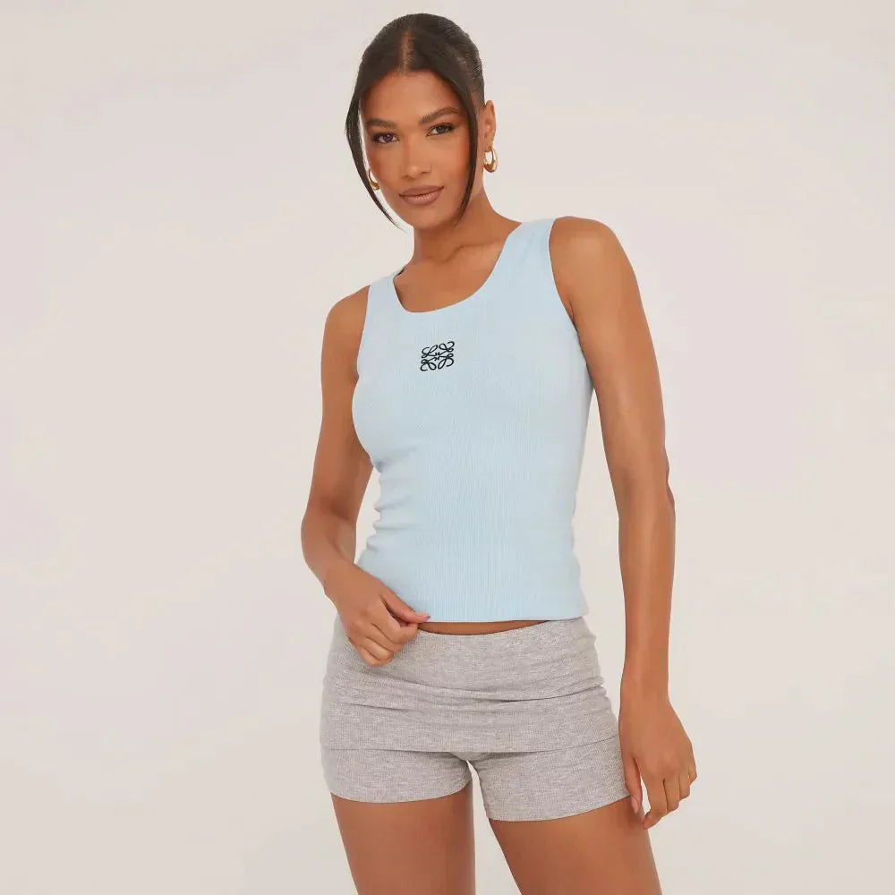 Women's elegant ripped tank top, delicate embroidery detail. Perfect for fashionable summer style.