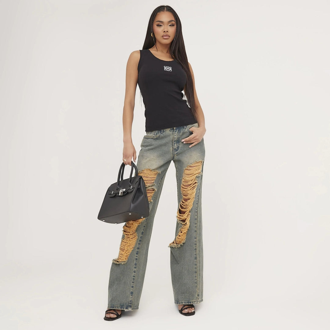Unique women's basic tank top with ripped detail & delicate embroidery. Trendy summer fashion.