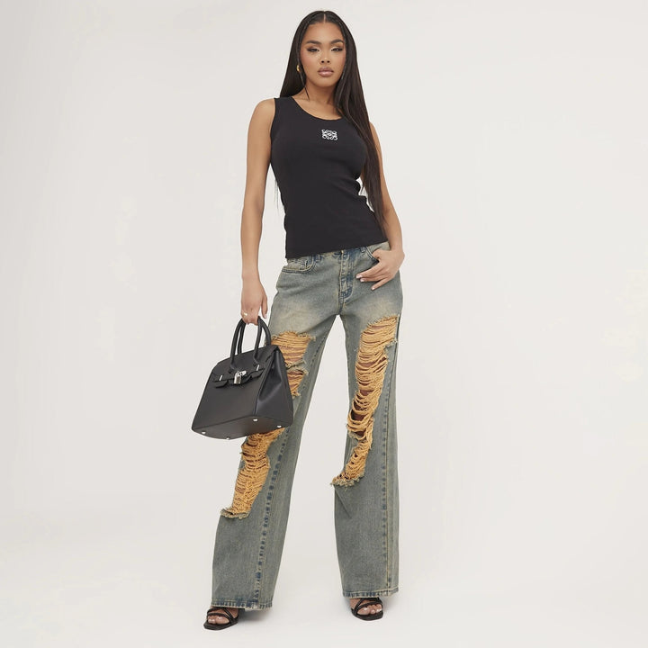 Unique women's basic tank top with ripped detail & delicate embroidery. Trendy summer fashion.