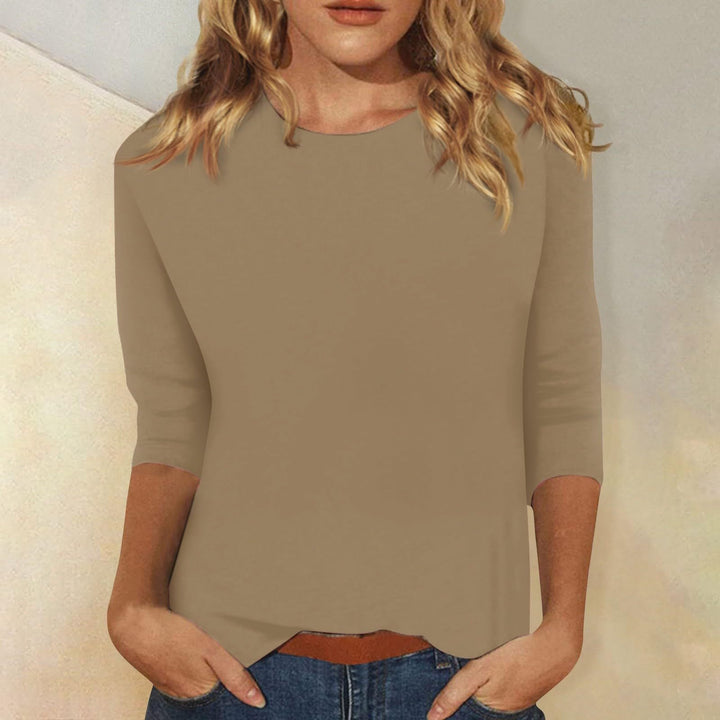 Wrinkle-free women's tee, round neck, three-quarter sleeves. An essential solid color top for everyday fashion.