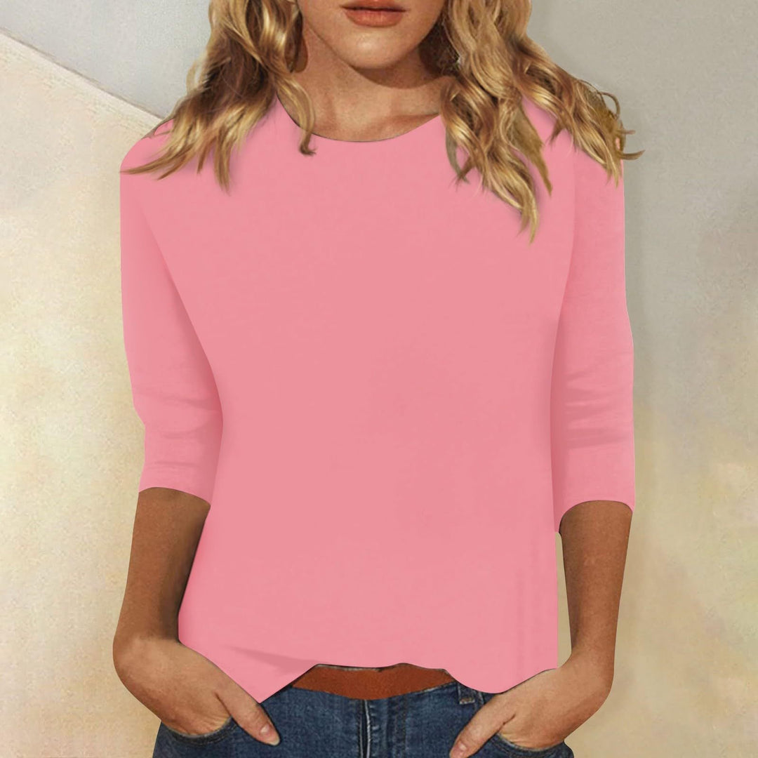 Stylish women's three-quarter sleeve top, round neck, solid, ideal for casual wear and effortless style.