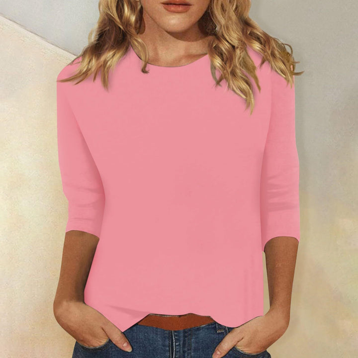 Stylish women's three-quarter sleeve top, round neck, solid, ideal for casual wear and effortless style.
