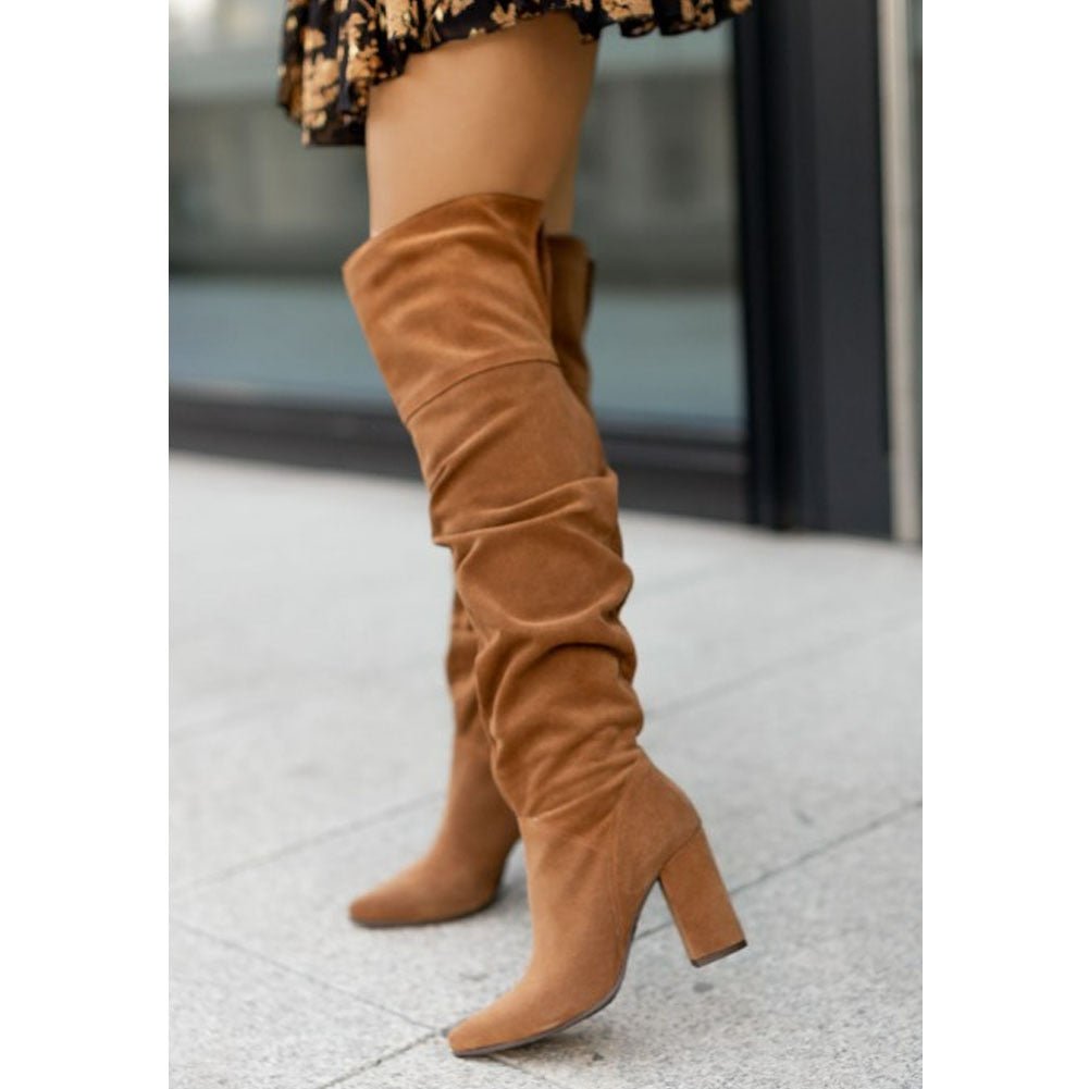 Elegant women's over-the-knee ruched boots featuring a sturdy block heel, great for fall/winter.