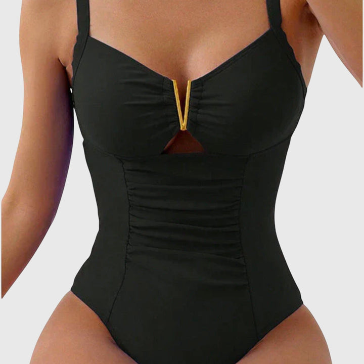 Elegant women's ruched v-neck one-piece swimwear, ideal for poolside or beach outings.