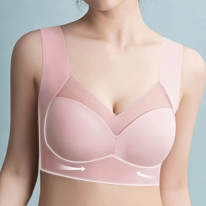 Stack of women's seamless comfort bras in black, white, nude, and pink for everyday support.