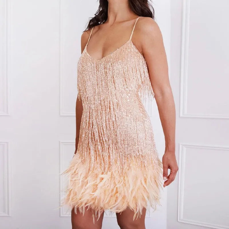 Detail of the unique feather and fringe design on a women's sequin cocktail dress, elegant party wear.