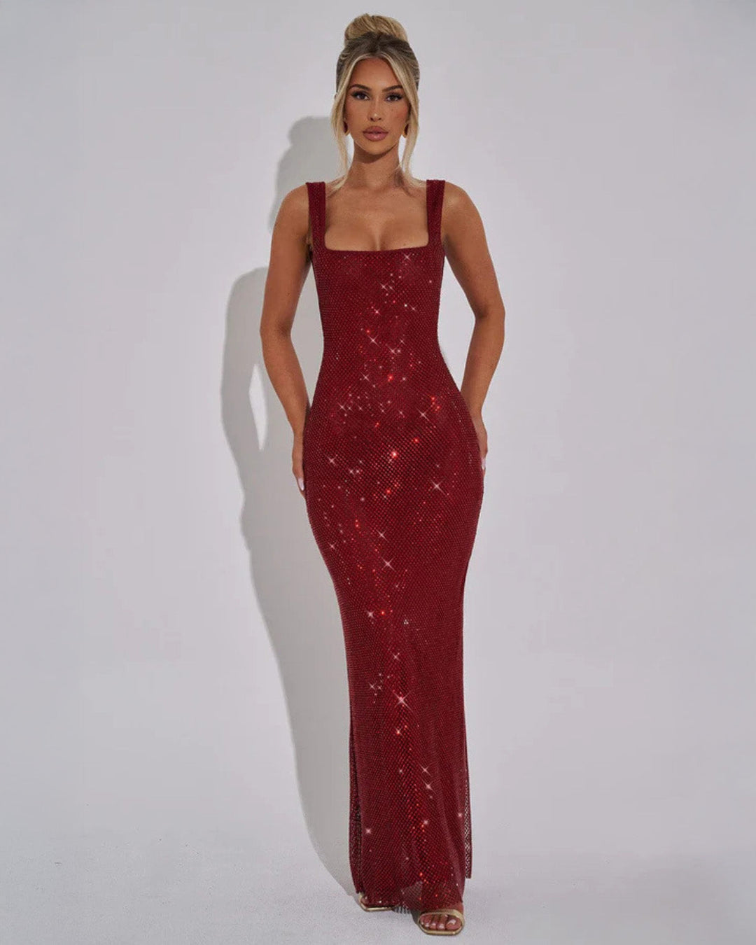 Women's shimmering embellished maxi evening gown for formal occasions.
