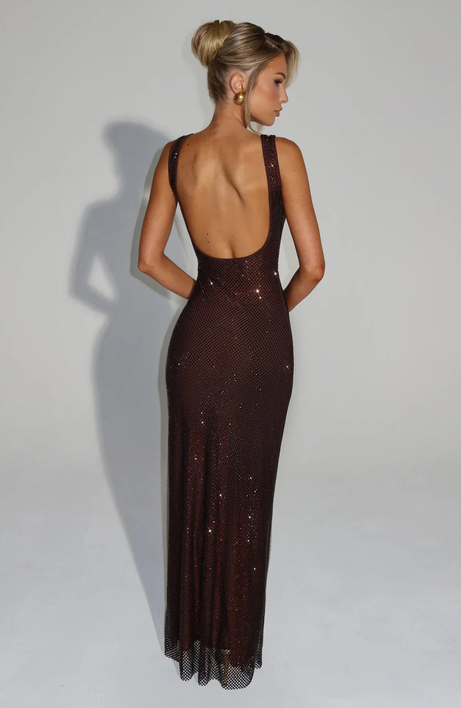 Women's evening gown, embellished and shimmering, perfect for formal events.