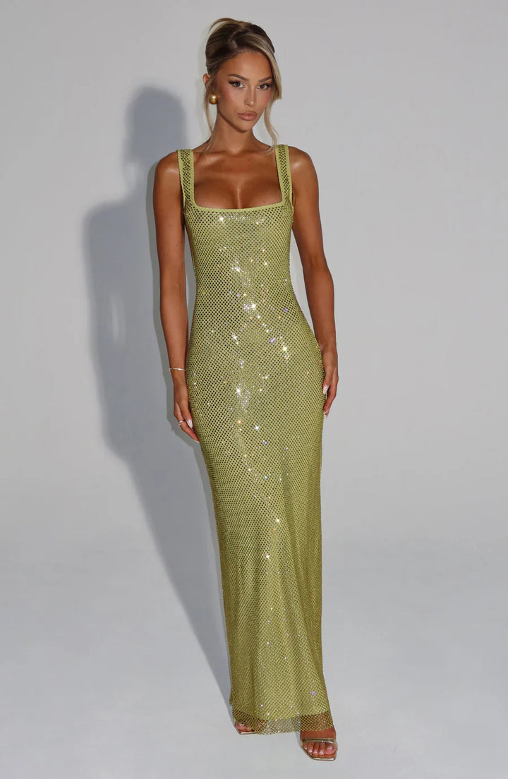 Luxurious embellished maxi dress, shimmering and elegant for women's special occasions.