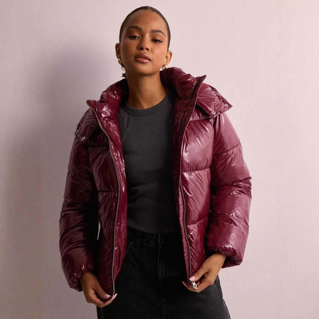 Fashionable ladies' shiny quilted jacket, a warm winter coat featuring a sleek design & removable hood.