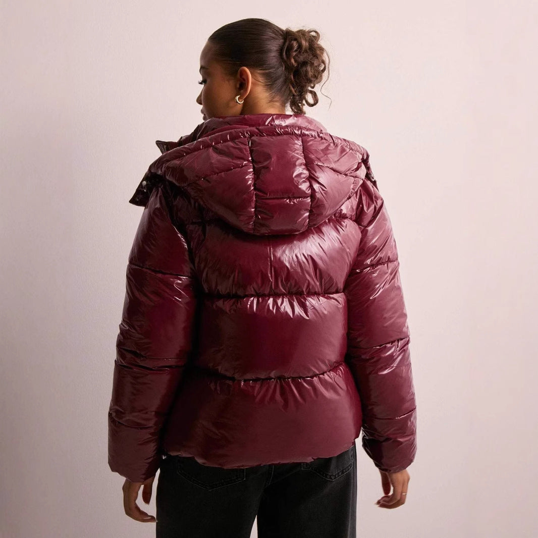 Versatile women's shiny quilted jacket, warm winter coat with removable hood, perfect for cold weather.