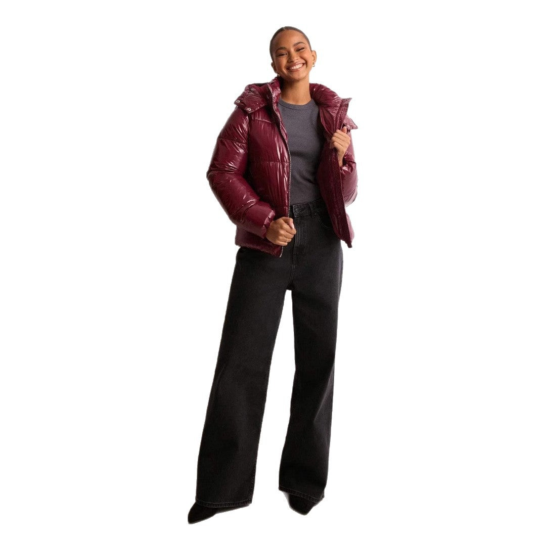 Elegant women's shiny quilted winter jacket, warm and stylish outerwear with a convenient removable hood.