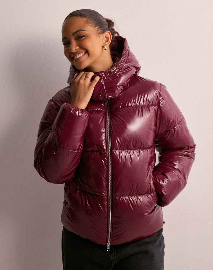 Chic women's shiny quilted jacket, a fashionable & warm winter coat with a practical removable hood.