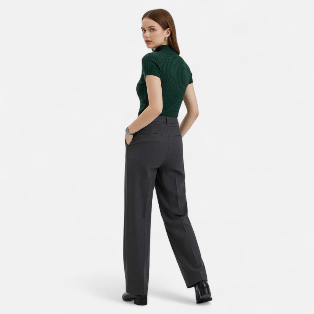 Sophisticated women's short-sleeve turtleneck blouse, an elegant top for a polished, modern look.