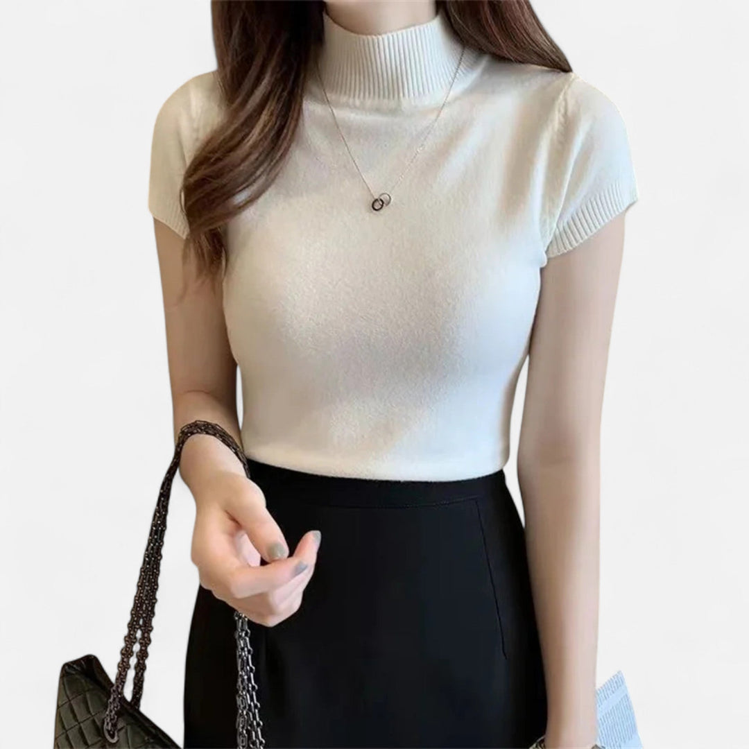 Fashionable short-sleeve turtleneck blouse for women, ideal for chic everyday wear and versatile styling.