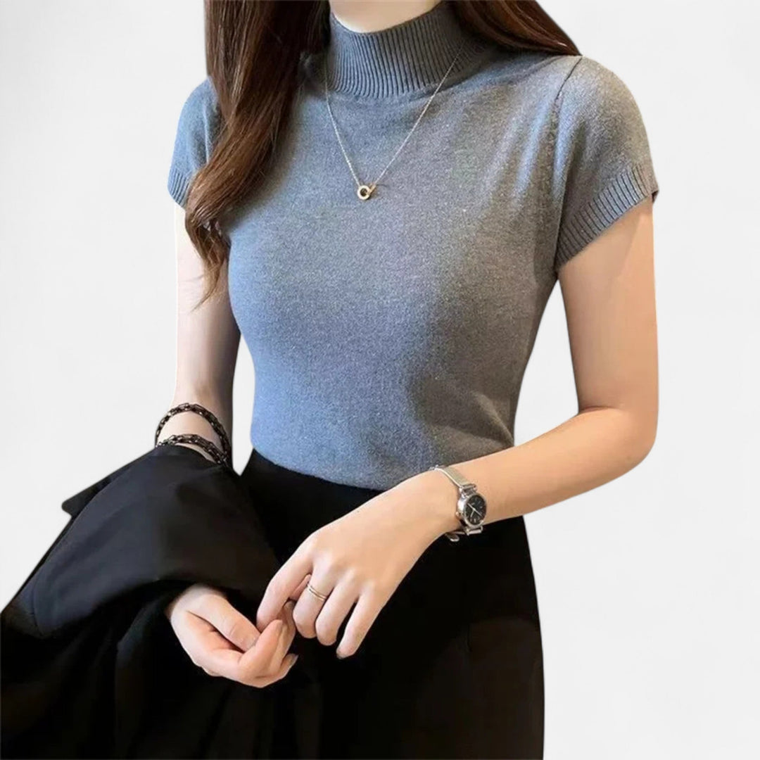 Classic women's short-sleeve turtleneck blouse, a timeless chic top perfect for any stylish wardrobe.