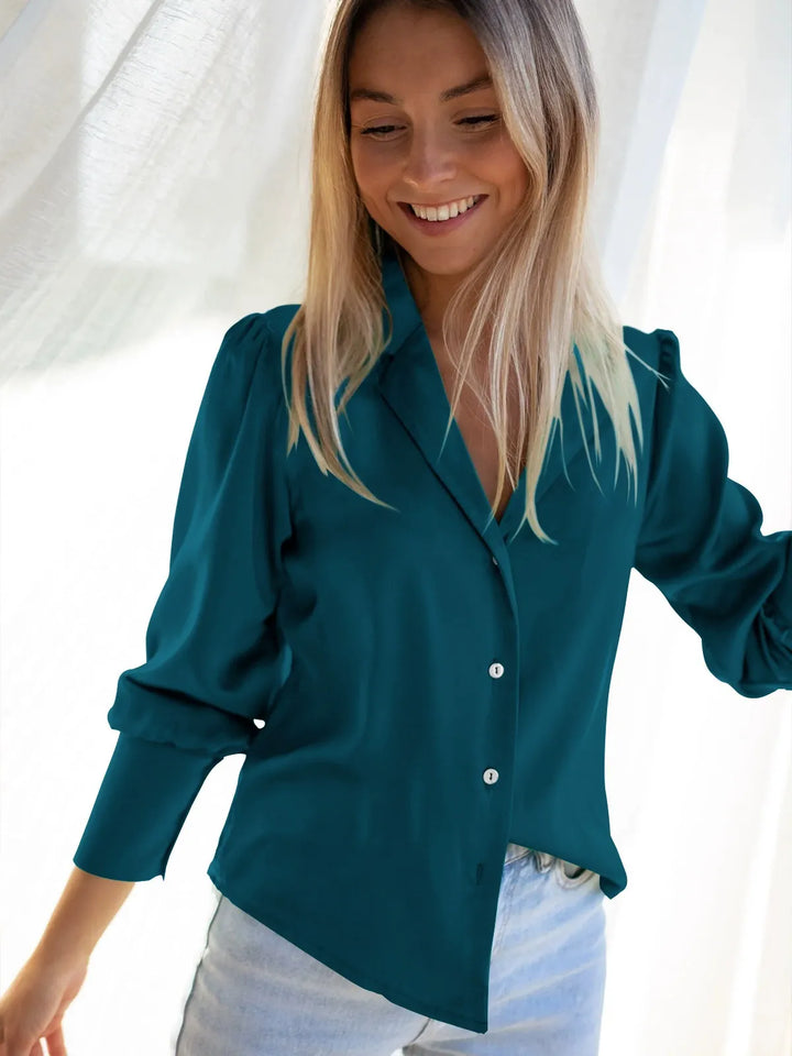 Comfortable women's button-front blouse. Versatile silky shirt with a relaxed fit for everyday chic.