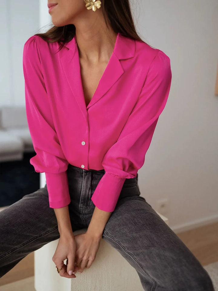 Relaxed fit silky women's blouse. Comfortable and elegant long sleeve top for versatile everyday wear.