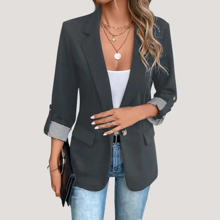 Chic women's tailored blazer, single-breasted with functional roll-up sleeves, a must-have fashion item