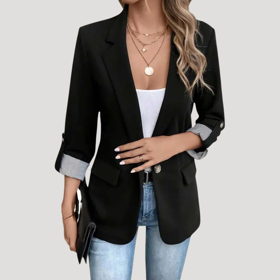 Elegant women's summer blazer, single-breasted silhouette with trendy roll-up sleeves, lightweight jacket