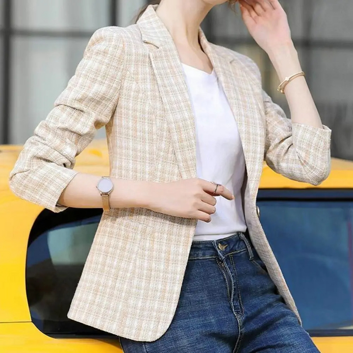 Elegant beige women's tailored blazer with a single-button closure, ideal for professional office wear.