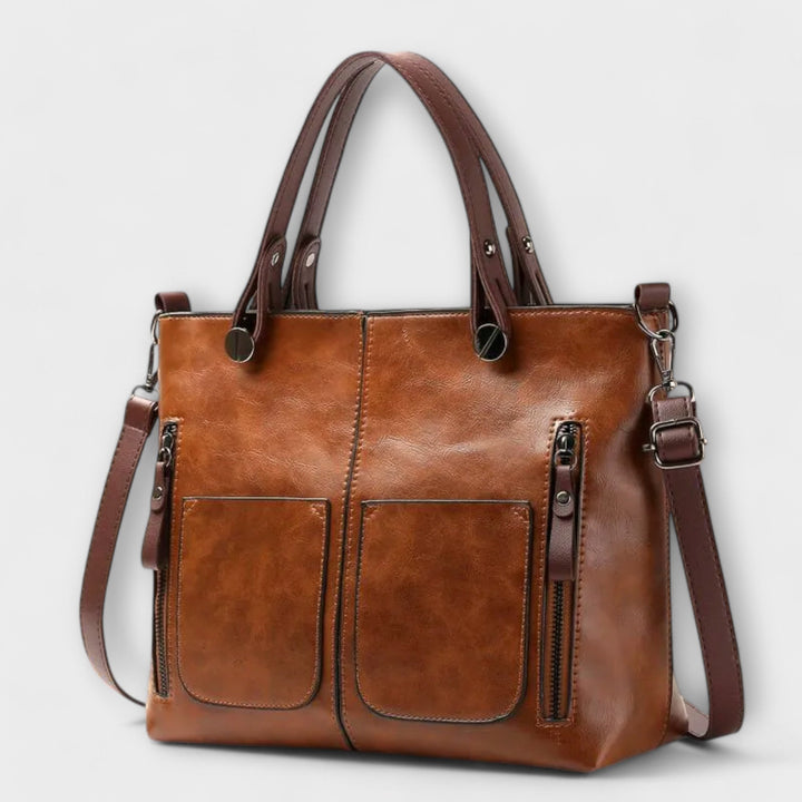 Women's sleek black functional everyday shoulder bag with adjustable strap, perfect for versatile daily use.
