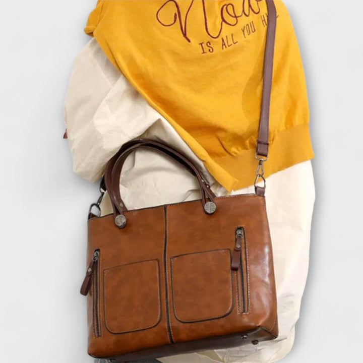 Close-up of the durable fabric and zipper detail on a women's functional everyday shoulder bag.