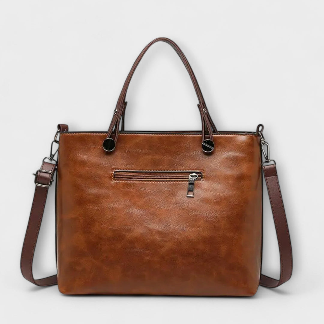 Front view of the women's everyday shoulder bag in navy, showcasing its clean design and functionality.