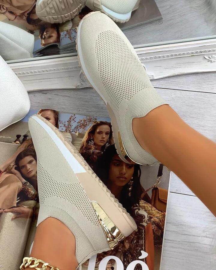 Orthopedic slip-on sneakers for women, offering arch support & foot comfort, ideal for walking & everyday wear.