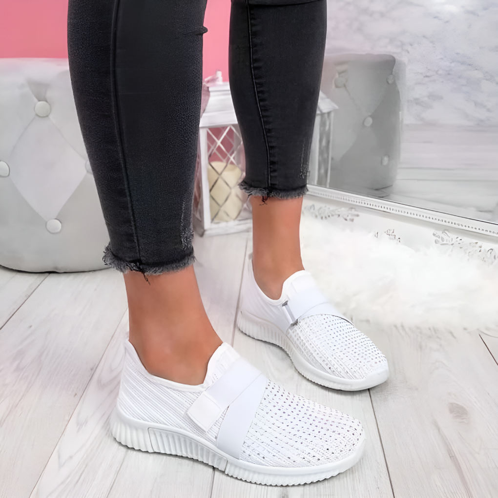 Stylish women's slip-on walking shoes featuring an elastic strap & lightweight comfort for travel.