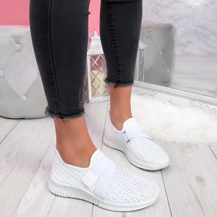 Stylish women's slip-on walking shoes featuring an elastic strap & lightweight comfort for travel.