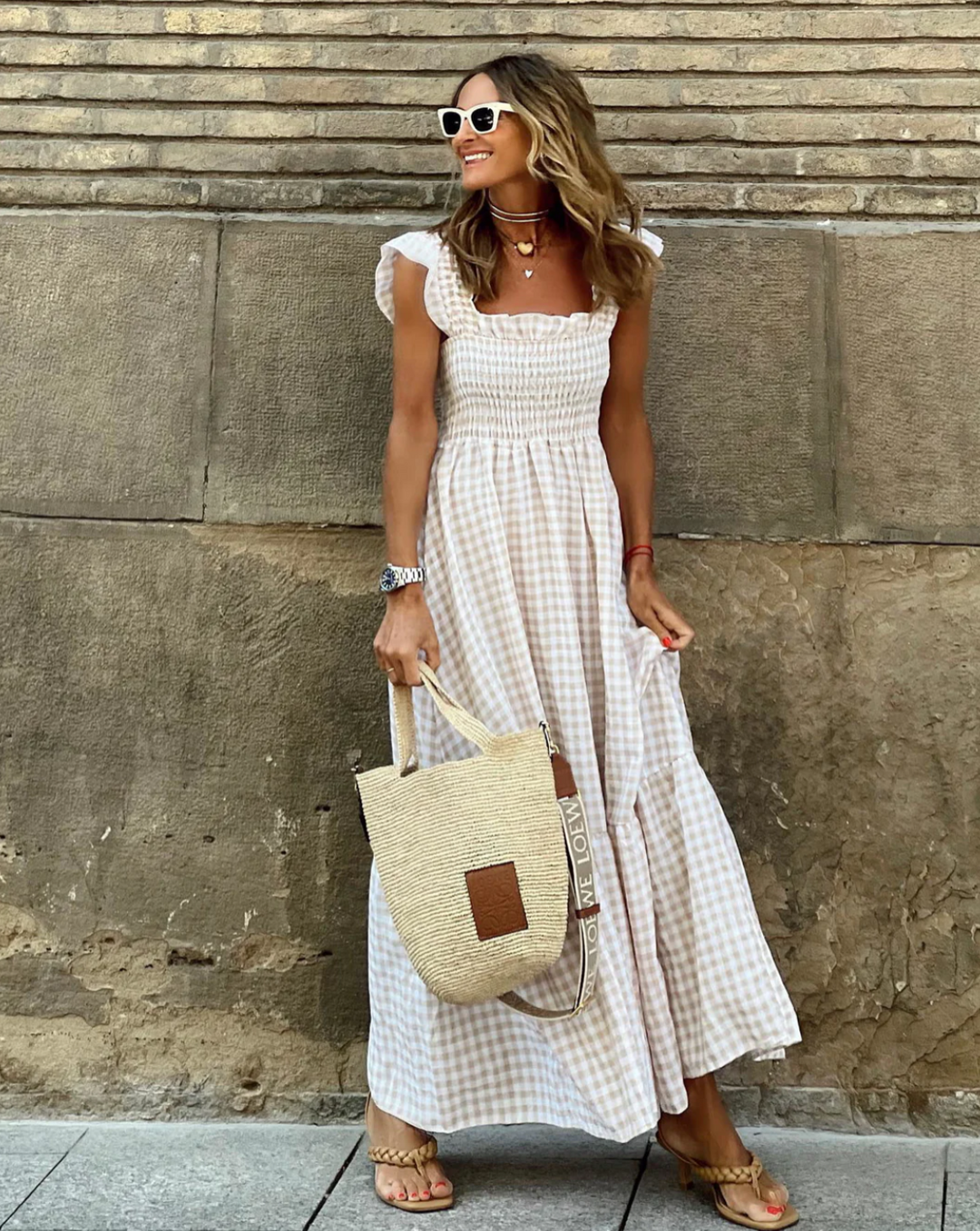 Women's smocked casual maxi dress in a flowing fabric, perfect for summer events.