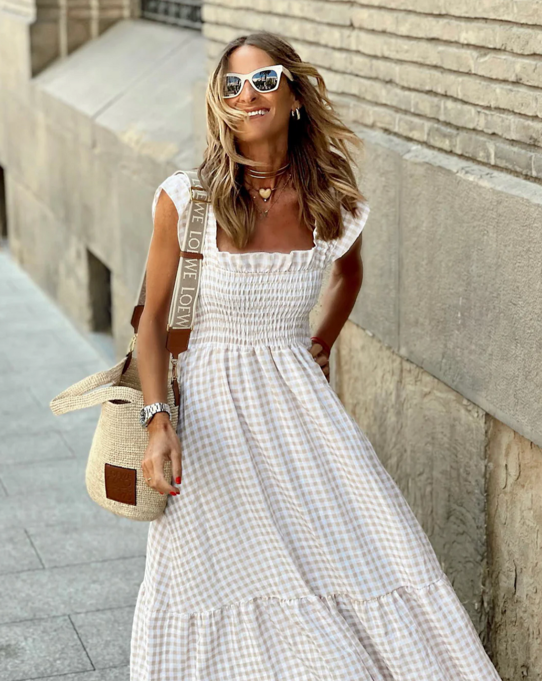 Summer fashion women's maxi dress, smocked bodice, flowing skirt for events.