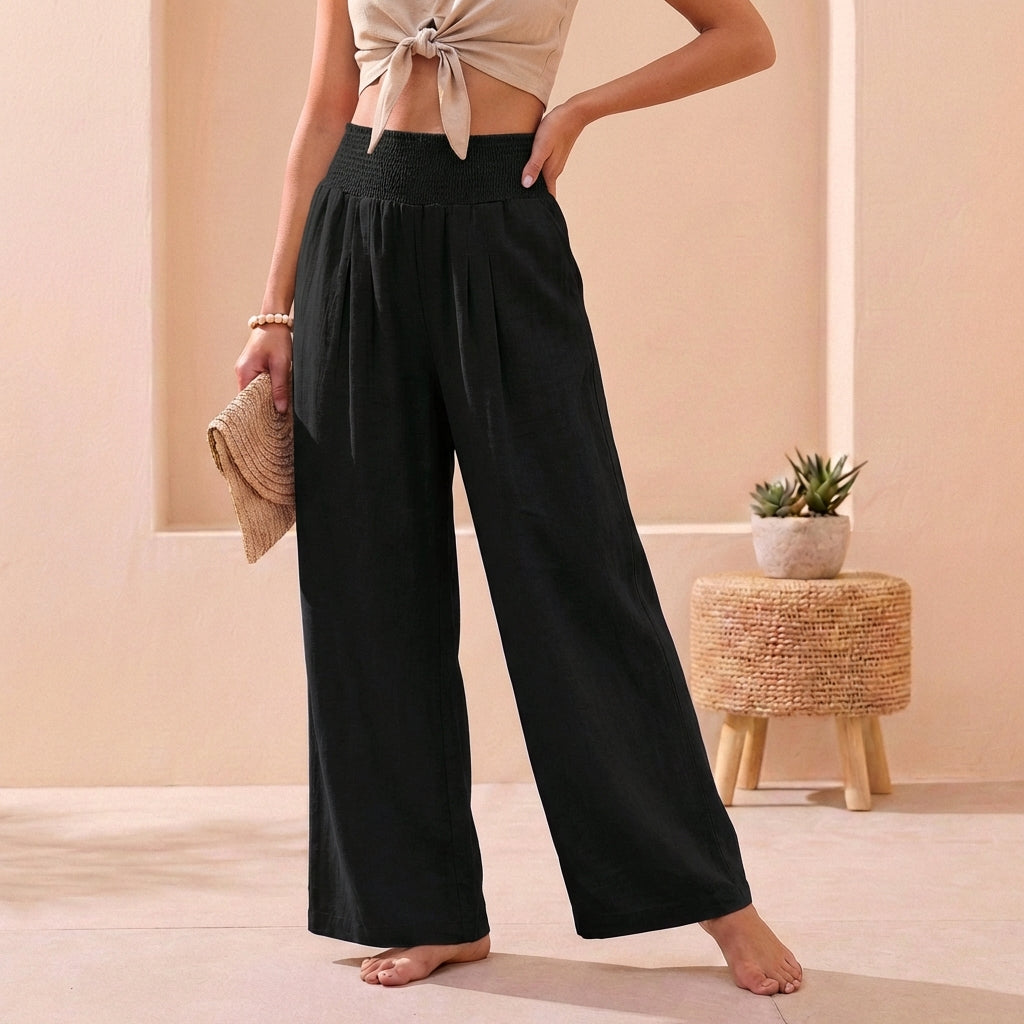 Stylish women's wide-leg trousers. Featuring a comfortable smocked high waist, ideal for elegant daily wear.