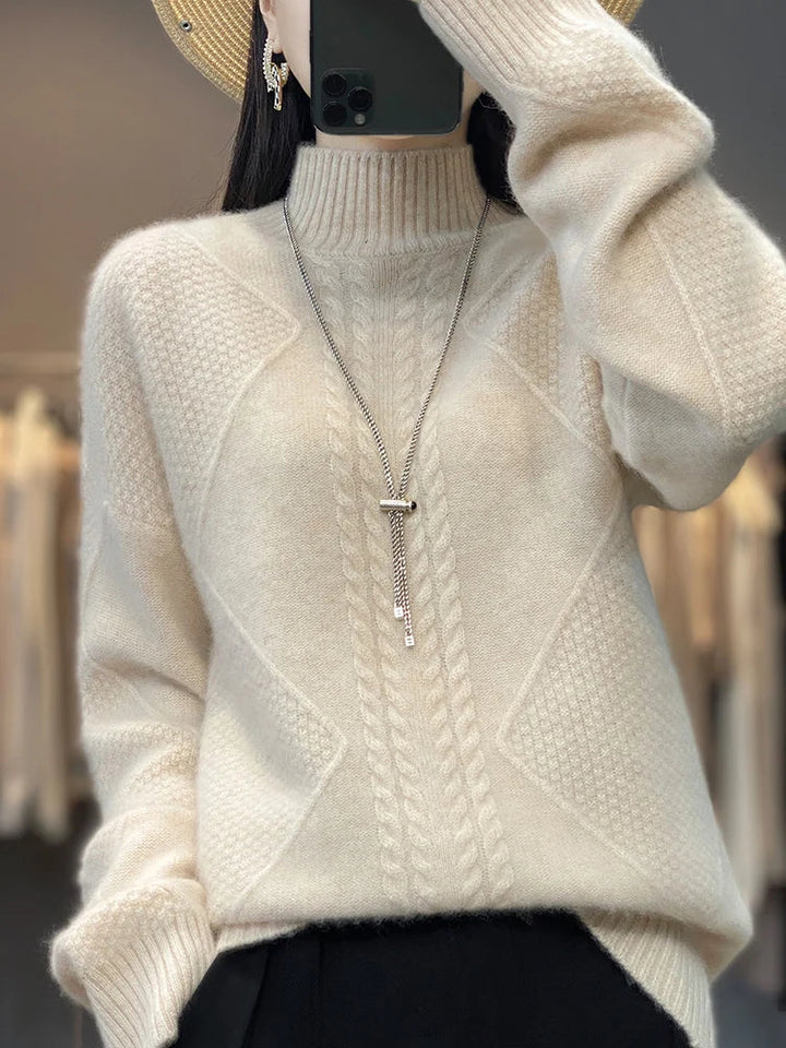 Women's soft beige cashmere roll neck jumper with elegant cable knit pattern, perfect for warm winter comfort.