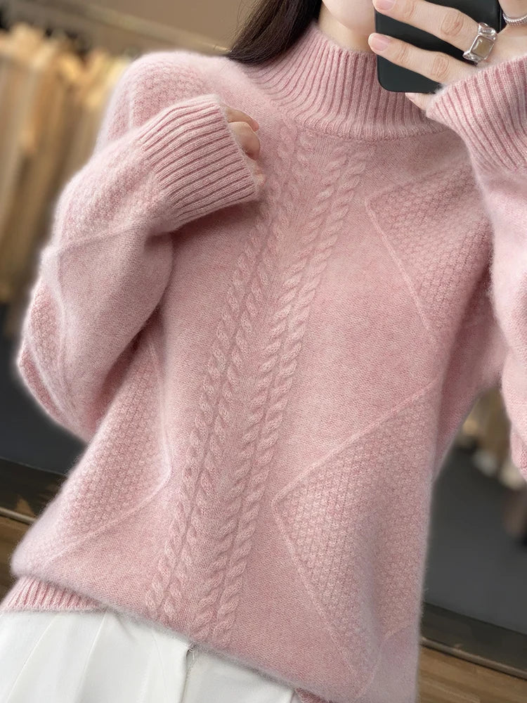 Elegant grey cashmere roll neck jumper for women, a luxurious cable knit sweater ideal for cold weather.