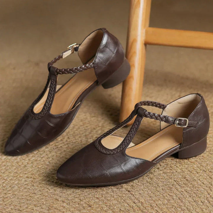 Women's classic T-strap Mary Jane shoes made from soft leather, featuring a stylish low heel design