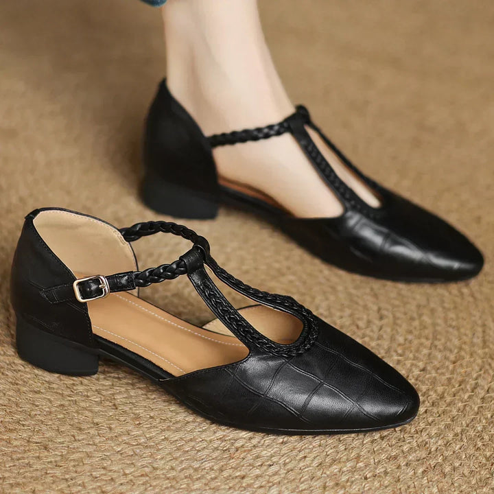 Elegant women's soft leather T-strap Mary Janes in navy blue, classic low heel footwear for casual chic